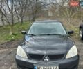 Черный Мицубиси Лансер, объемом двигателя 1.6 л и пробегом 260 тыс. км за 3800 $, фото 1 на Automoto.ua
