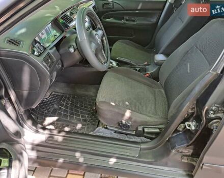 Чорний Міцубісі Lancer, об'ємом двигуна 1.58 л та пробігом 280 тис. км за 3950 $, фото 14 на Automoto.ua