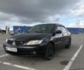 Чорний Міцубісі Lancer, об'ємом двигуна 1.6 л та пробігом 241 тис. км за 4310 $, фото 1 на Automoto.ua