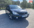 Чорний Міцубісі Lancer, об'ємом двигуна 1.58 л та пробігом 236 тис. км за 4500 $, фото 1 на Automoto.ua