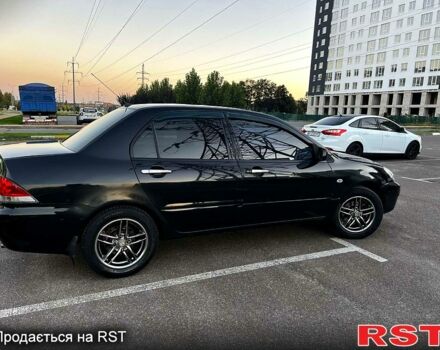 Чорний Міцубісі Lancer, об'ємом двигуна 1.6 л та пробігом 329 тис. км за 3500 $, фото 1 на Automoto.ua