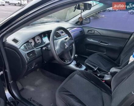 Чорний Міцубісі Lancer, об'ємом двигуна 1.58 л та пробігом 329 тис. км за 3500 $, фото 6 на Automoto.ua
