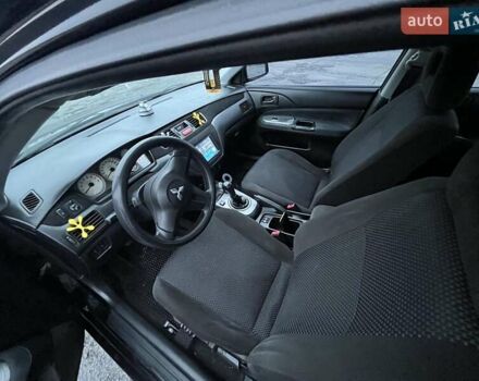 Чорний Міцубісі Lancer, об'ємом двигуна 1.58 л та пробігом 282 тис. км за 4100 $, фото 5 на Automoto.ua