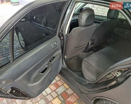 Чорний Міцубісі Lancer, об'ємом двигуна 1.58 л та пробігом 280 тис. км за 3950 $, фото 8 на Automoto.ua