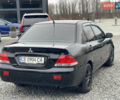Чорний Міцубісі Lancer, об'ємом двигуна 1.58 л та пробігом 230 тис. км за 3350 $, фото 8 на Automoto.ua