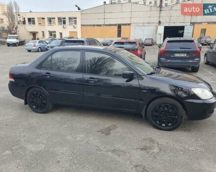 Черный Мицубиси Лансер, объемом двигателя 1.58 л и пробегом 222 тыс. км за 2999 $, фото 4 на Automoto.ua