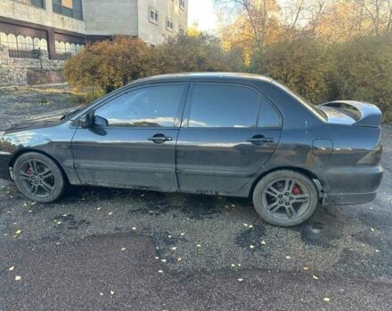 Черный Мицубиси Лансер, объемом двигателя 2 л и пробегом 200 тыс. км за 2999 $, фото 3 на Automoto.ua