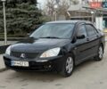 Черный Мицубиси Лансер, объемом двигателя 1.58 л и пробегом 245 тыс. км за 4300 $, фото 1 на Automoto.ua