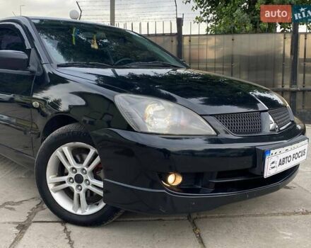 Чорний Міцубісі Lancer, об'ємом двигуна 2 л та пробігом 248 тис. км за 4990 $, фото 3 на Automoto.ua