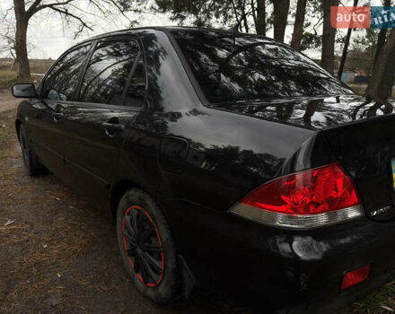 Чорний Міцубісі Lancer, об'ємом двигуна 1.58 л та пробігом 210 тис. км за 3900 $, фото 3 на Automoto.ua