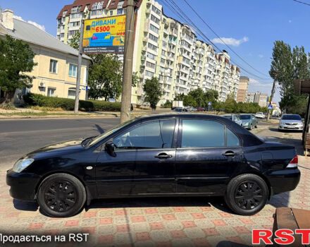 Черный Мицубиси Лансер, объемом двигателя 1.6 л и пробегом 300 тыс. км за 3599 $, фото 5 на Automoto.ua