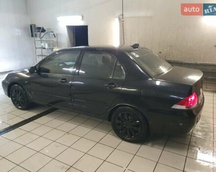 Чорний Міцубісі Lancer, об'ємом двигуна 1.58 л та пробігом 222 тис. км за 2999 $, фото 4 на Automoto.ua