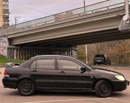Чорний Міцубісі Lancer, об'ємом двигуна 1.58 л та пробігом 230 тис. км за 4350 $, фото 4 на Automoto.ua