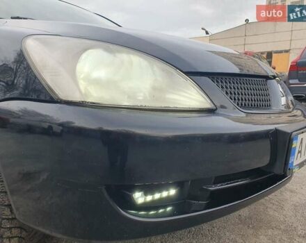 Черный Мицубиси Лансер, объемом двигателя 1.58 л и пробегом 222 тыс. км за 2999 $, фото 3 на Automoto.ua