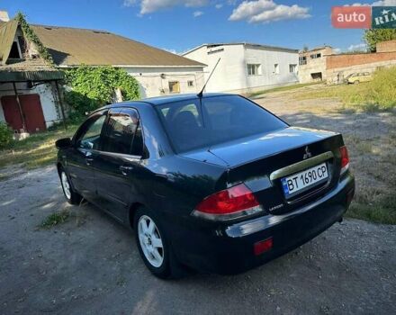 Мицубиси Лансер 2006 в Киеве на Automoto.ua Черный Мицубиси Лансер, объемом двигателя 1.58 л и пробегом 268 тыс. км за 3400 $, фото 5 на Automoto.ua