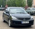 Чорний Міцубісі Lancer, об'ємом двигуна 2 л та пробігом 220 тис. км за 3599 $, фото 1 на Automoto.ua