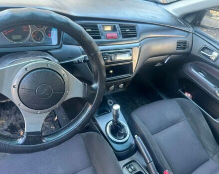 Черный Мицубиси Лансер, объемом двигателя 2 л и пробегом 200 тыс. км за 2999 $, фото 7 на Automoto.ua