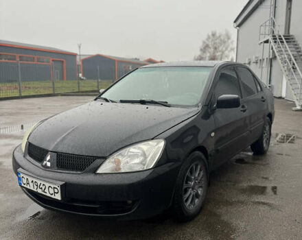 Черный Мицубиси Лансер, объемом двигателя 1.6 л и пробегом 368 тыс. км за 3200 $, фото 2 на Automoto.ua