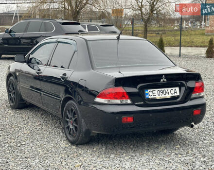 Чорний Міцубісі Lancer, об'ємом двигуна 1.58 л та пробігом 230 тис. км за 3350 $, фото 10 на Automoto.ua