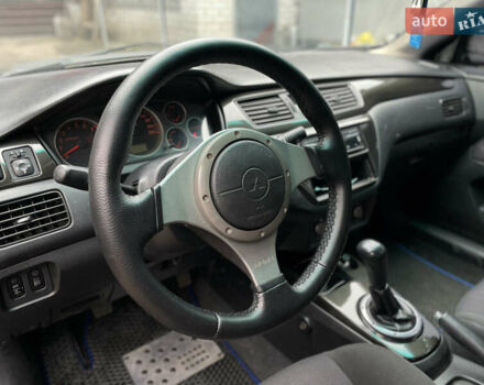 Чорний Міцубісі Lancer, об'ємом двигуна 2 л та пробігом 242 тис. км за 5900 $, фото 13 на Automoto.ua