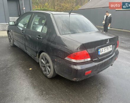 Чорний Міцубісі Lancer, об'ємом двигуна 1.58 л та пробігом 257 тис. км за 2400 $, фото 1 на Automoto.ua