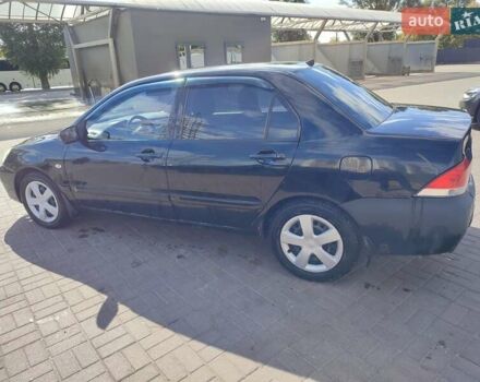 Черный Мицубиси Лансер, объемом двигателя 1.58 л и пробегом 128 тыс. км за 4600 $, фото 25 на Automoto.ua