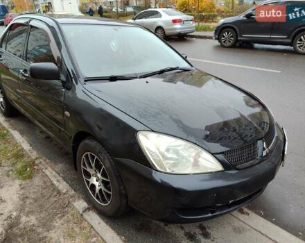 Черный Мицубиси Лансер, объемом двигателя 1.58 л и пробегом 270 тыс. км за 4000 $, фото 7 на Automoto.ua