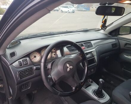 Черный Мицубиси Лансер, объемом двигателя 1.6 л и пробегом 290 тыс. км за 3200 $, фото 5 на Automoto.ua