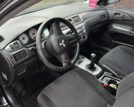 Чорний Міцубісі Lancer, об'ємом двигуна 1.58 л та пробігом 230 тис. км за 3350 $, фото 8 на Automoto.ua
