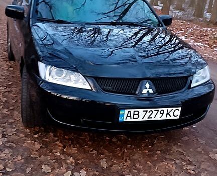 Чорний Міцубісі Lancer, об'ємом двигуна 1.6 л та пробігом 345 тис. км за 3700 $, фото 7 на Automoto.ua