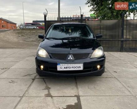 Чорний Міцубісі Lancer, об'ємом двигуна 2 л та пробігом 248 тис. км за 4990 $, фото 1 на Automoto.ua