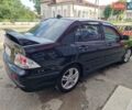 Черный Мицубиси Лансер, объемом двигателя 2 л и пробегом 168 тыс. км за 4999 $, фото 8 на Automoto.ua