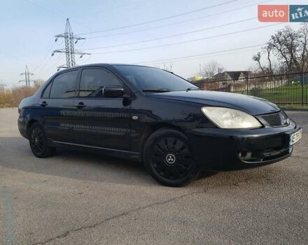 Чорний Міцубісі Lancer, об'ємом двигуна 1.58 л та пробігом 290 тис. км за 3200 $, фото 2 на Automoto.ua