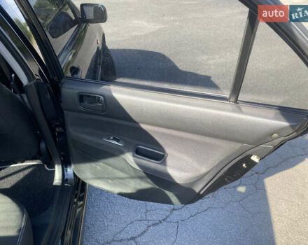 Чорний Міцубісі Lancer, об'ємом двигуна 1.58 л та пробігом 236 тис. км за 4500 $, фото 12 на Automoto.ua