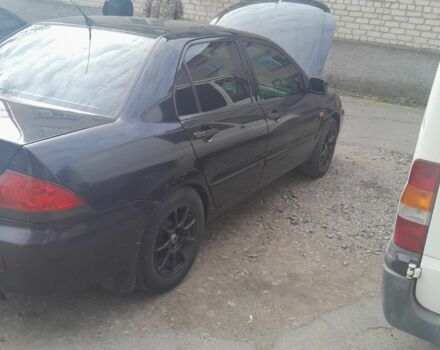 Черный Мицубиси Лансер, объемом двигателя 1.6 л и пробегом 260 тыс. км за 3800 $, фото 3 на Automoto.ua