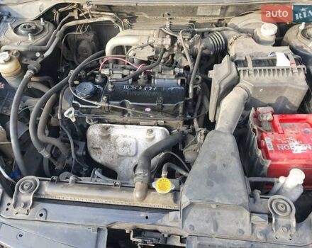 Черный Мицубиси Лансер, объемом двигателя 1.58 л и пробегом 222 тыс. км за 2999 $, фото 14 на Automoto.ua