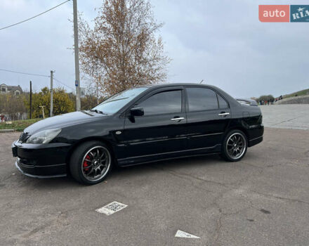 Чорний Міцубісі Lancer, об'ємом двигуна 2 л та пробігом 242 тис. км за 5900 $, фото 6 на Automoto.ua