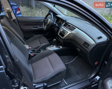 Черный Мицубиси Лансер, объемом двигателя 2 л и пробегом 255 тыс. км за 5000 $, фото 9 на Automoto.ua