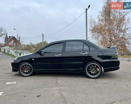 Чорний Міцубісі Lancer, об'ємом двигуна 2 л та пробігом 242 тис. км за 5900 $, фото 5 на Automoto.ua