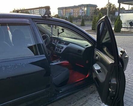 Черный Мицубиси Лансер, объемом двигателя 1.6 л и пробегом 257 тыс. км за 4500 $, фото 4 на Automoto.ua