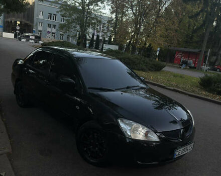 Черный Мицубиси Лансер, объемом двигателя 1.6 л и пробегом 233 тыс. км за 3650 $, фото 8 на Automoto.ua
