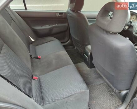 Черный Мицубиси Лансер, объемом двигателя 1.58 л и пробегом 270 тыс. км за 4000 $, фото 5 на Automoto.ua