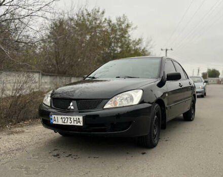 Чорний Міцубісі Lancer, об'ємом двигуна 1.58 л та пробігом 230 тис. км за 3350 $, фото 1 на Automoto.ua