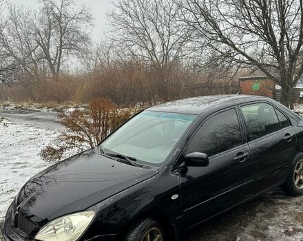 Чорний Міцубісі Lancer, об'ємом двигуна 1.6 л та пробігом 213 тис. км за 4000 $, фото 4 на Automoto.ua