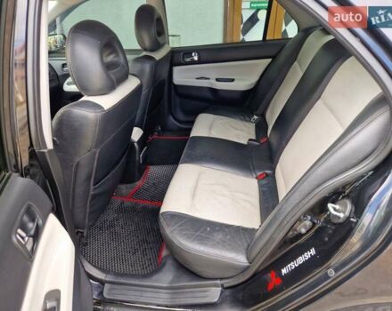 Черный Мицубиси Лансер, объемом двигателя 2 л и пробегом 168 тыс. км за 4999 $, фото 18 на Automoto.ua