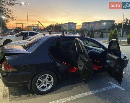 Черный Мицубиси Лансер, объемом двигателя 1.6 л и пробегом 257 тыс. км за 4500 $, фото 2 на Automoto.ua