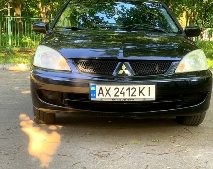 Черный Мицубиси Лансер, объемом двигателя 1.6 л и пробегом 285 тыс. км за 4400 $, фото 2 на Automoto.ua