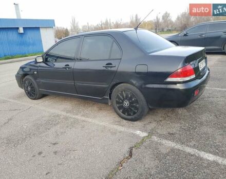 Чорний Міцубісі Lancer, об'ємом двигуна 1.58 л та пробігом 290 тис. км за 3200 $, фото 11 на Automoto.ua