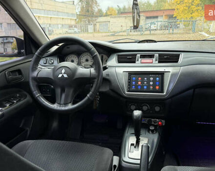 Чорний Міцубісі Lancer, об'ємом двигуна 1.58 л та пробігом 386 тис. км за 4450 $, фото 18 на Automoto.ua