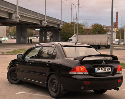 Чорний Міцубісі Lancer, об'ємом двигуна 1.58 л та пробігом 230 тис. км за 4350 $, фото 2 на Automoto.ua